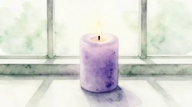 A single lit candle glows in a peaceful morning setting